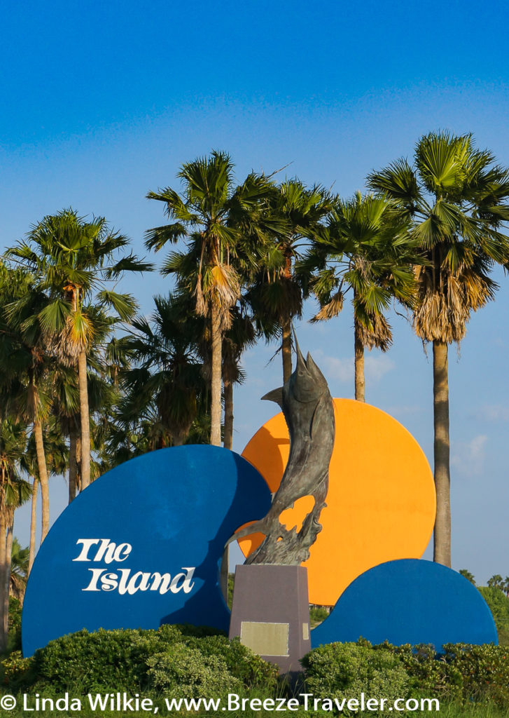 The Island sign welcomes visitors to Padre Island.