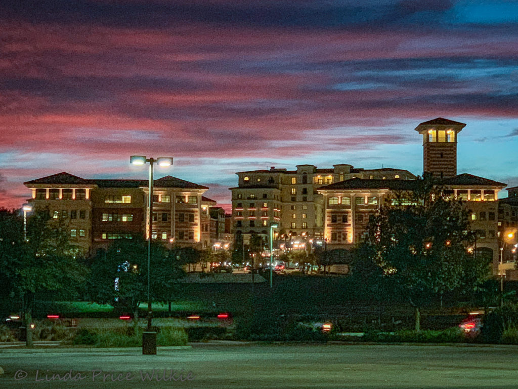 A photo of a Texas Violet Crown sunset behind Éilan Hotel Spa.