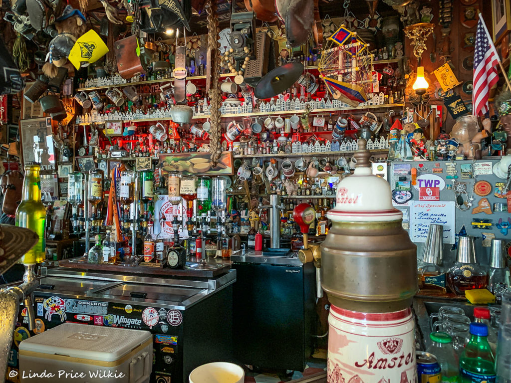 A photo of Charlie's which is full of knickknacks and memorabilia dating from its opening in 1941 through the over 75 years it's been in business.