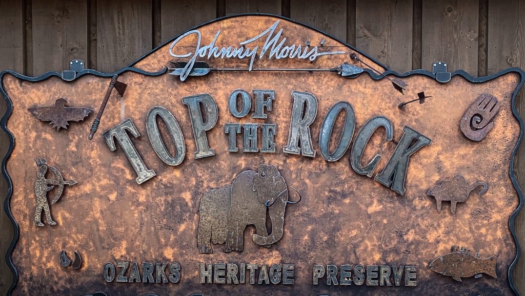 A photo of Johnny Morris' Top of the Rock Ozark Heritage Preserve sign at Big Cedar Lodge.