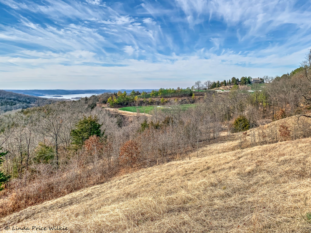 A photo of a view of the golf course and Table Rock Lake in the distance from the lookout point.